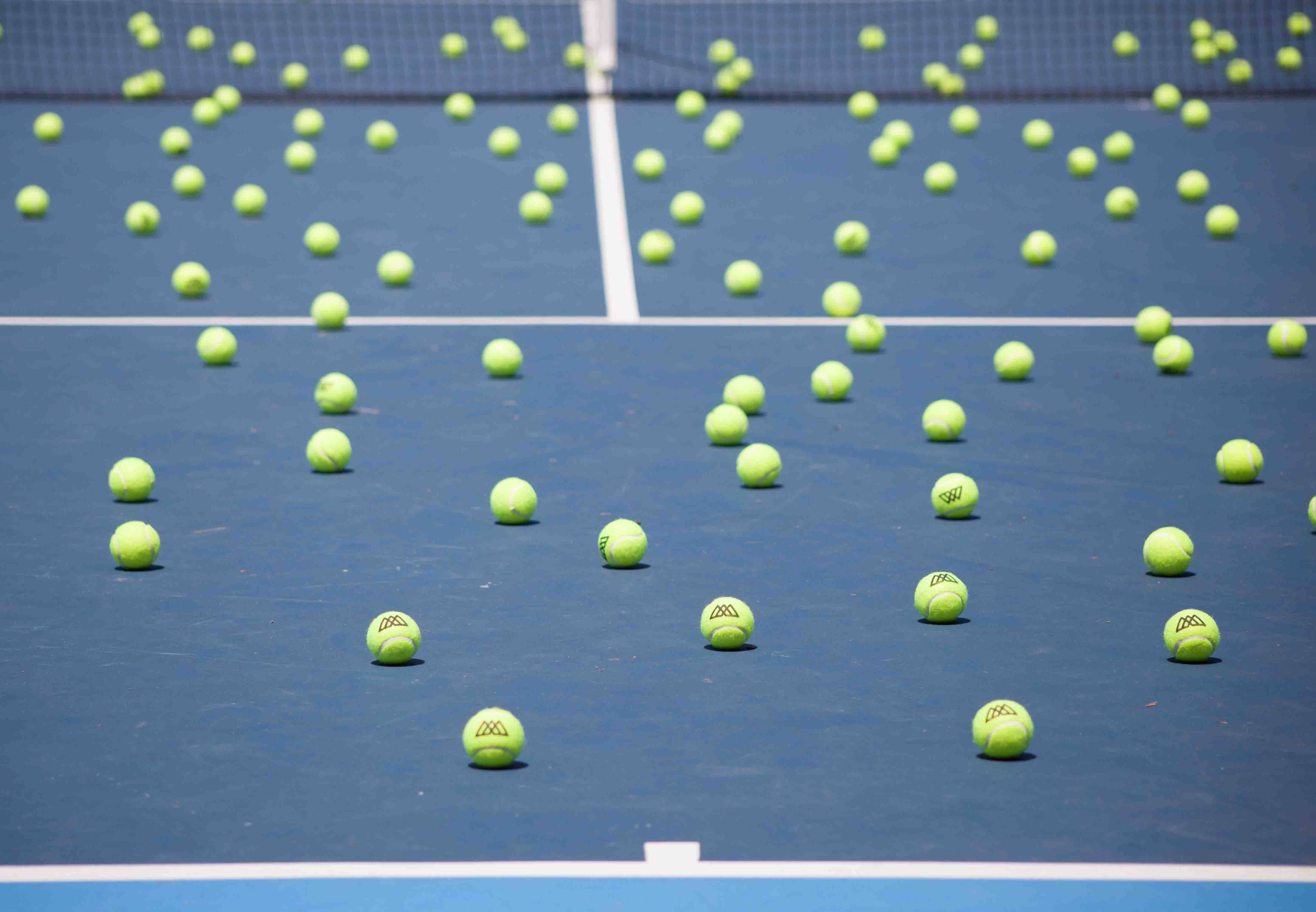 Tennis court covered with dozens of tennis balls — a real-world detection challenge